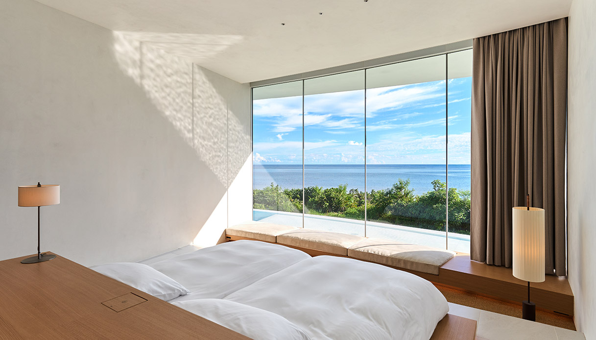 Chambre de villa en terre avec vue sur l'océan